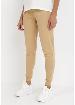 Beżowe Spodnie Laodite ze sklepu Born2be Odzież w kategorii Spodnie damskie - zdjęcie 131143109