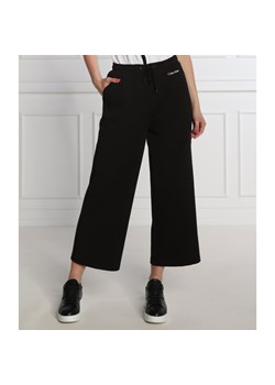 Calvin Klein Spodnie dresowe | flare fit ze sklepu Gomez Fashion Store w kategorii Spodnie damskie - zdjęcie 141198787