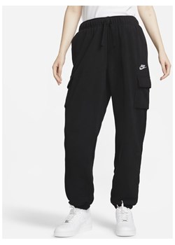 Damskie spodnie dresowe o kroju bojówek oversize ze średnim stanem Nike Sportswear Club Fleece - Czerń ze sklepu Nike poland w kategorii Spodnie damskie - zdjęcie 142191915