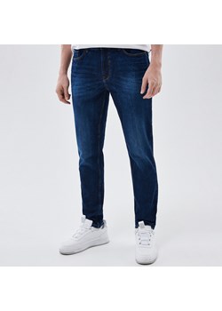 Cropp - Jeansy męskie slim z efektem sprania - granatowy ze sklepu Cropp w kategorii Jeansy męskie - zdjęcie 144417836