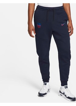 Męskie spodnie typu jogger FC Barcelona Tech Fleece - Niebieski ze sklepu Nike poland w kategorii Spodnie męskie - zdjęcie 144443489