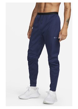 Męskie spodnie do biegania Nike Storm-FIT ADV Run Division - Niebieski ze sklepu Nike poland w kategorii Spodnie męskie - zdjęcie 146846398