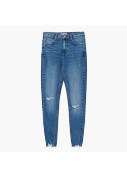 Cropp - Niebieskie jeansy skinny z dziurami - niebieski ze sklepu Cropp w kategorii Jeansy damskie - zdjęcie 149370248