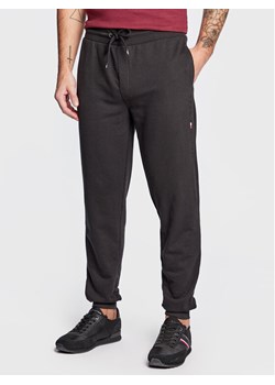 Tommy Hilfiger Spodnie dresowe UM0UM02667 Czarny Relaxed Fit ze sklepu MODIVO w kategorii Spodnie męskie - zdjęcie 150157899