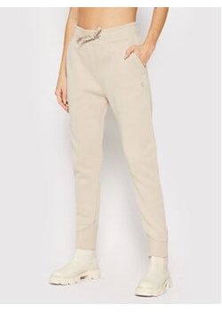 G-Star Raw Spodnie dresowe Premium Core D20761-C235-1214 Beżowy Regular Fit ze sklepu MODIVO w kategorii Spodnie damskie - zdjęcie 152524688