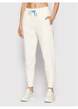 Puma Spodnie dresowe Infuse 533423 Biały Relaxed Fit ze sklepu MODIVO w kategorii Spodnie damskie - zdjęcie 152647847