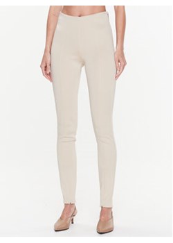 Calvin Klein Legginsy Technical K20K205357 Beżowy Slim Fit ze sklepu MODIVO w kategorii Spodnie damskie - zdjęcie 153437517