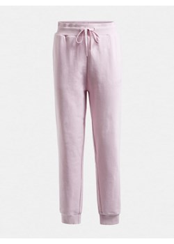 Damskie spodnie dresowe GUESS ALENE CUFF LONG PANTS - różowe ze sklepu Sportstylestory.com w kategorii Spodnie damskie - zdjęcie 153752565