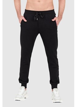 DOLCE & GABBANA - Czarne spodnie dresowe z haftowanym logo ze sklepu outfit.pl w kategorii Spodnie męskie - zdjęcie 156835079