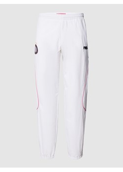 Spodnie treningowe z paskami w kontrastowym kolorze — MATW x REVIEW Drop 10 ze sklepu Peek&Cloppenburg  w kategorii Spodnie męskie - zdjęcie 160759245