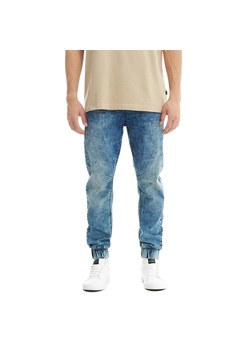 Cropp - Jeansowe joggery z efektem sprania - niebieski ze sklepu Cropp w kategorii Spodnie męskie - zdjęcie 160970185