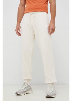 Reebok Classic spodnie dresowe bawełniane kolor beżowy gładkie HS9153-NONDYE ze sklepu PRM w kategorii Spodnie męskie - zdjęcie 161396695