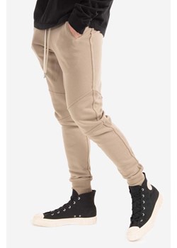 John Elliott spodnie dresowe bawełniane Escobar Sweatpanst kolor beżowy gładkie C100B00921B-KREMOWY ze sklepu PRM w kategorii Spodnie męskie - zdjęcie 161406226