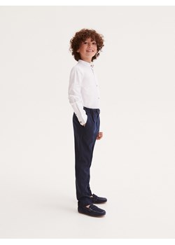 Reserved - Garniturowe spodnie w kratę slim - granatowy ze sklepu Reserved w kategorii Spodnie chłopięce - zdjęcie 161447339
