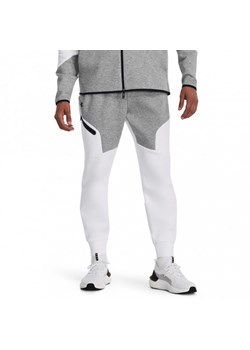 Męskie spodnie treningowe Under Armour UA Unstoppable Flc Joggers - białe ze sklepu Sportstylestory.com w kategorii Spodnie męskie - zdjęcie 161669819