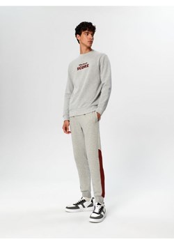 Sinsay - Spodnie dresowe jogger - kremowy ze sklepu Sinsay w kategorii Spodnie męskie - zdjęcie 162094499