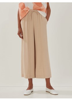Someday Spodnie &quot;Calex&quot; w kolorze beżowym ze sklepu Limango Polska w kategorii Spodnie damskie - zdjęcie 163790937