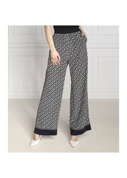 Tommy Hilfiger Spodnie MONOGRAM | flare fit ze sklepu Gomez Fashion Store w kategorii Spodnie damskie - zdjęcie 164323977
