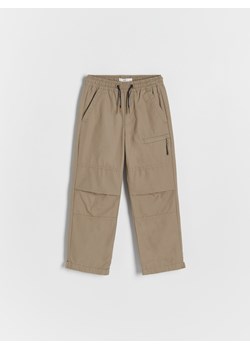 Reserved - Ocieplane spodnie jogger - musztardowy ze sklepu Reserved w kategorii Spodnie chłopięce - zdjęcie 164873935