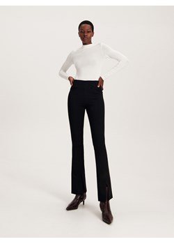 Reserved - Spodnie z rozcięciami przy nogawkach - czarny ze sklepu Reserved w kategorii Spodnie damskie - zdjęcie 164927307
