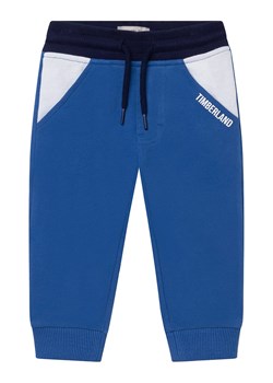 Timberland Spodnie dresowe w kolorze niebieskim ze sklepu Limango Polska w kategorii Spodnie chłopięce - zdjęcie 164938596