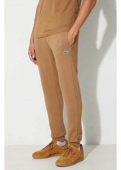 Lacoste spodnie dresowe męskie kolor brązowy gładkie ze sklepu PRM w kategorii Spodnie męskie - zdjęcie 166194939