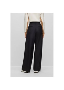 BOSS BLACK Wełniane spodnie Tilwida Alica | flare fit ze sklepu Gomez Fashion Store w kategorii Spodnie damskie - zdjęcie 166294145
