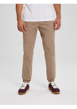 Spodnie JOGS ZIP Beż M ze sklepu Diverse w kategorii Spodnie męskie - zdjęcie 166495138