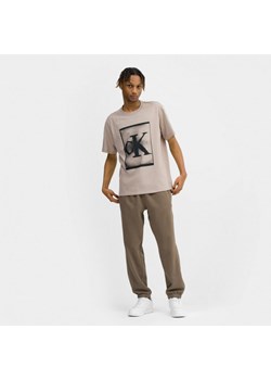 Męska koszulka treningowa Calvin Klein Men 00GMS3K113 - beżowa ze sklepu Sportstylestory.com w kategorii T-shirty męskie - zdjęcie 166933657