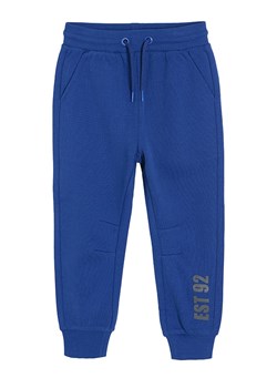 COOL CLUB Spodnie dresowe w kolorze niebieskim ze sklepu Limango Polska w kategorii Spodnie chłopięce - zdjęcie 167625315