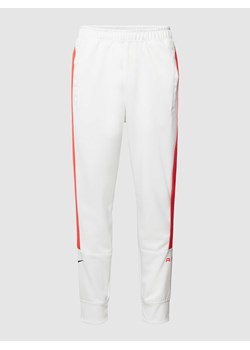 Spodnie dresowe z paskami w kontrastowym kolorze ze sklepu Peek&Cloppenburg  w kategorii Spodnie męskie - zdjęcie 167668359