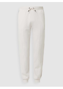 Spodnie z dzianiny dresowej z paskami z logo ze sklepu Peek&Cloppenburg  w kategorii Spodnie damskie - zdjęcie 167776115