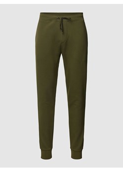 Spodnie dresowe o kroju regular fit z wpuszczanymi kieszeniami ze sklepu Peek&Cloppenburg  w kategorii Spodnie męskie - zdjęcie 167934045
