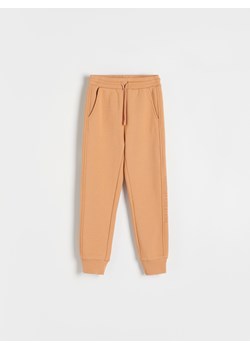 Reserved - Spodnie dresowe z bawełną - beżowy ze sklepu Reserved w kategorii Spodnie dziewczęce - zdjęcie 167947185