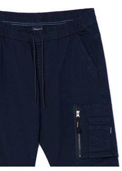 Cropp - Granatowe jeansy jogger chino - surowy granatowy ze sklepu Cropp w kategorii Spodnie męskie - zdjęcie 167952337