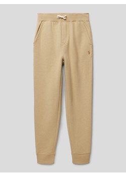 Spodnie dresowe z elastycznym ściągaczem ze sklepu Peek&Cloppenburg  w kategorii Spodnie chłopięce - zdjęcie 168107799