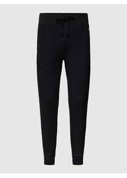 Spodnie dresowe z fakturowanym wzorem model ‘WAFFLE’ ze sklepu Peek&Cloppenburg  w kategorii Spodnie męskie - zdjęcie 168257778