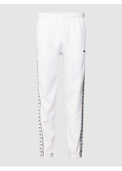 Spodnie dresowe z paskami z logo ze sklepu Peek&Cloppenburg  w kategorii Spodnie męskie - zdjęcie 168295809