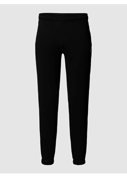 Spodnie dresowe z paskami z logo model ‘TAPE’ ze sklepu Peek&Cloppenburg  w kategorii Spodnie męskie - zdjęcie 168319787