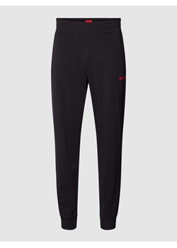 Spodnie dresowe w jednolitym kolorze z elastycznym pasem ze sklepu Peek&Cloppenburg  w kategorii Spodnie męskie - zdjęcie 168324255