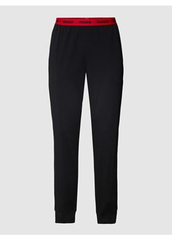 Spodnie dresowe z elastycznym pasem z logo model ‘Linked’ ze sklepu Peek&Cloppenburg  w kategorii Spodnie męskie - zdjęcie 168324405