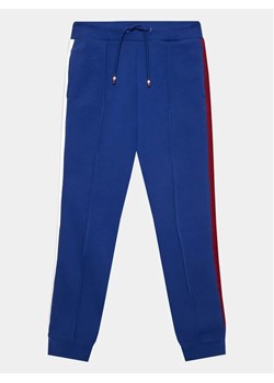 Tommy Hilfiger Spodnie dresowe Globral Stripes KB0KB08404 D Niebieski Regular Fit ze sklepu MODIVO w kategorii Spodnie chłopięce - zdjęcie 168379967