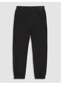 Coccodrillo Spodnie dresowe WC3120102EVG Czarny Regular Fit ze sklepu MODIVO w kategorii Spodnie chłopięce - zdjęcie 168425499