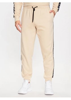 Kappa Spodnie dresowe 313014 Brązowy Regular Fit ze sklepu MODIVO w kategorii Spodnie męskie - zdjęcie 168430015