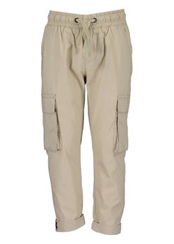 Blue Seven Spodnie materiałowe 837052 X Beżowy Regular Fit ze sklepu MODIVO w kategorii Spodnie chłopięce - zdjęcie 168437456