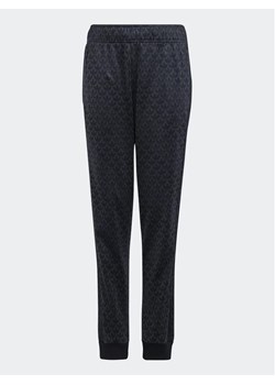adidas Spodnie dresowe Monogram Print H62941 Szary Regular Fit ze sklepu MODIVO w kategorii Spodnie dziewczęce - zdjęcie 168438836