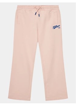 Tommy Hilfiger Spodnie dresowe Hilfiger Script Wide Sweatpant KG0KG07751 Różowy Regular Fit ze sklepu MODIVO w kategorii Spodnie dziewczęce - zdjęcie 168447538