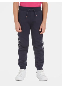 Tommy Hilfiger Spodnie dresowe Tape KB0KB08476 Granatowy Regular Fit ze sklepu MODIVO w kategorii Spodnie chłopięce - zdjęcie 168509205