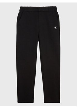 Calvin Klein Jeans Spodnie materiałowe Punto IB0IB01482 Czarny Regular Fit ze sklepu MODIVO w kategorii Spodnie chłopięce - zdjęcie 168512428