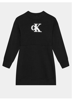 Calvin Klein Jeans Sukienka dzianinowa Metallic Monogram IG0IG02315 Czarny Regular Fit ze sklepu MODIVO w kategorii Sukienki dziewczęce - zdjęcie 168525868